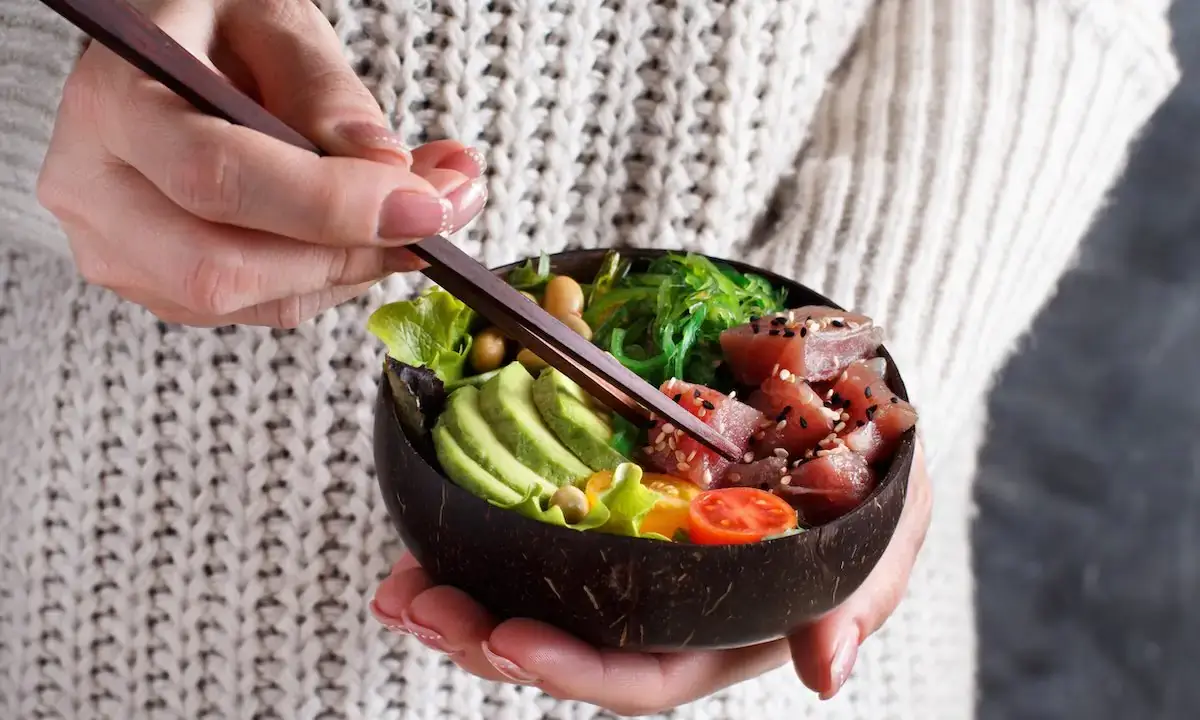 Poke bowl with cubed tuna protein, avocado, seaweed salad