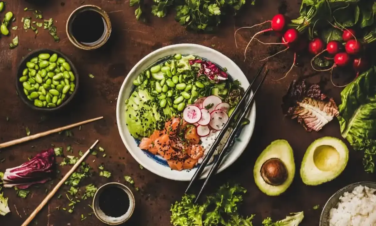 Poke bowl with salmon, rice, avocado, and mixed greens