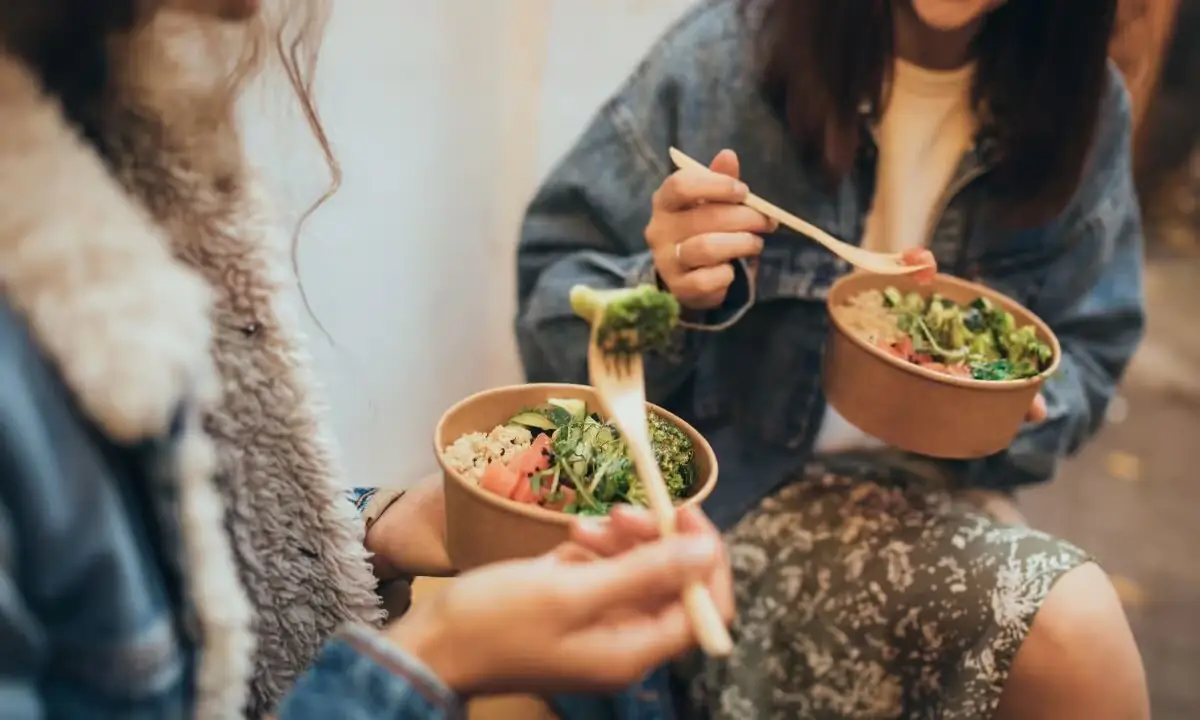 Assorted poke bowls with fresh greens, rice, and colorful toppings